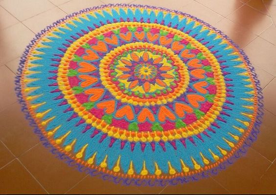 Circular rangoli with rich colors and designs