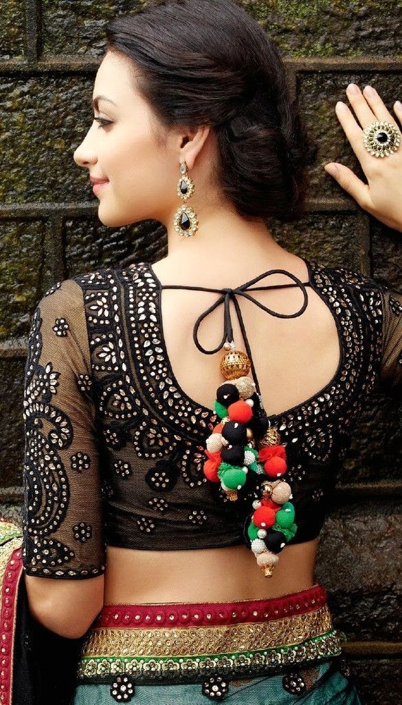 Gorgeous black blouse with stonework and transparent sleeves