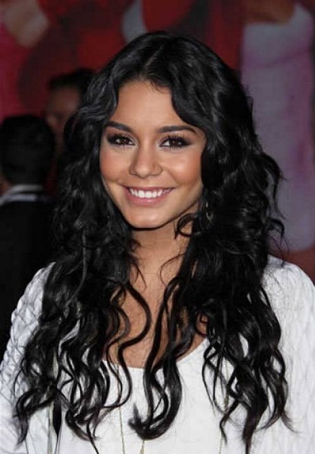 simple-long-layered-hairstyles-center-parted-for-round-faces-women-with-thick-curly-hair-in-natural-black-color