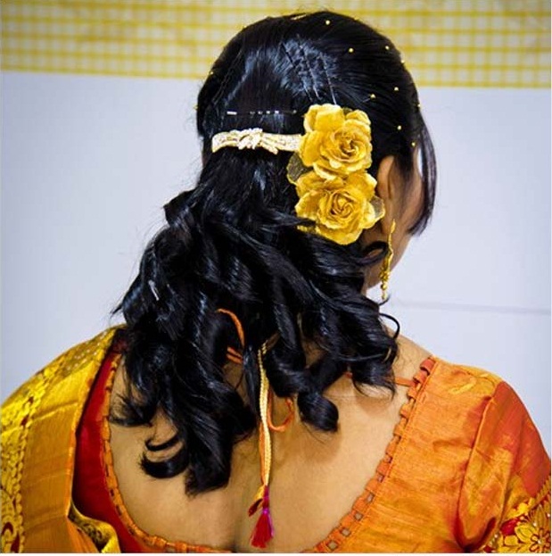 Intricately curled semi-open hairstyle