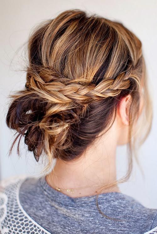 A messy bun with double braids
