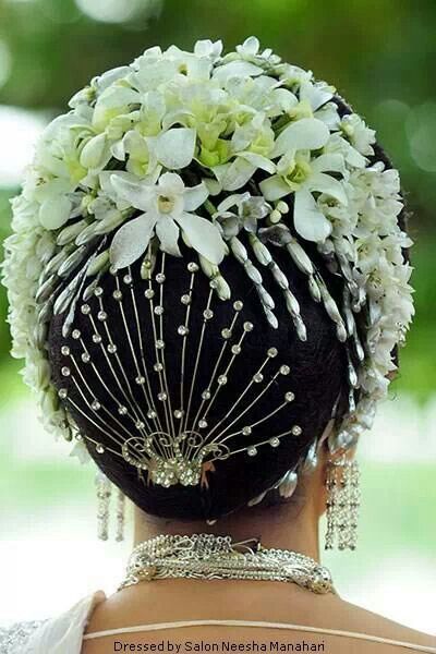 Heavy bun with floral decorations and accessories