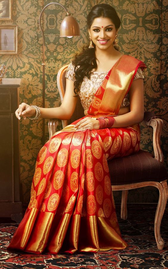 Semi-open hairstyle with curls for sarees