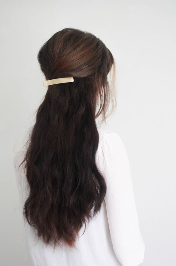 Simple back pinned hairdo for long hairs