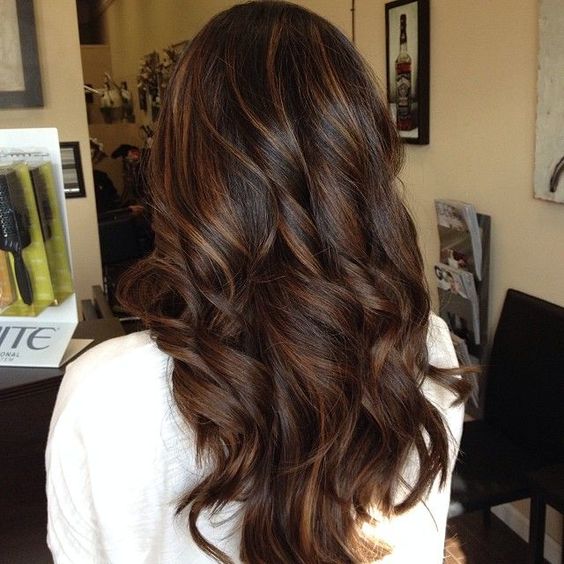 Open curly hairstyle with highlights