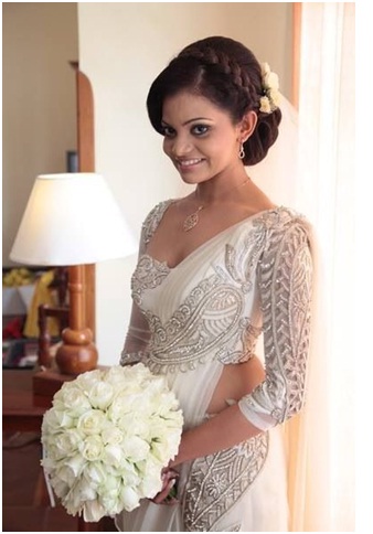 Low bun hairstyle for christian wedding in saree