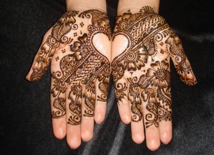 Mehndi design for palms, with a heart