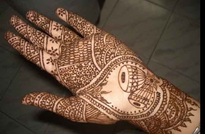 Unique bridal henna design with trumpet pair for palms