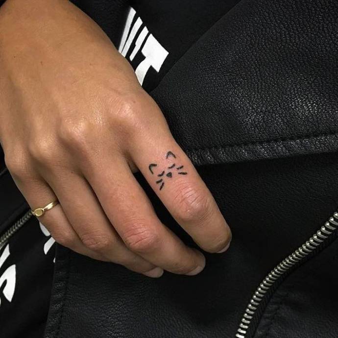 Cat finger tattoos
