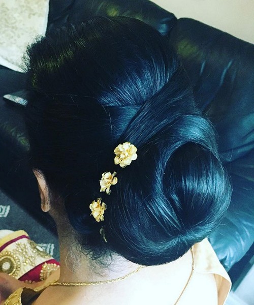 Criss-cross bun accented with flower