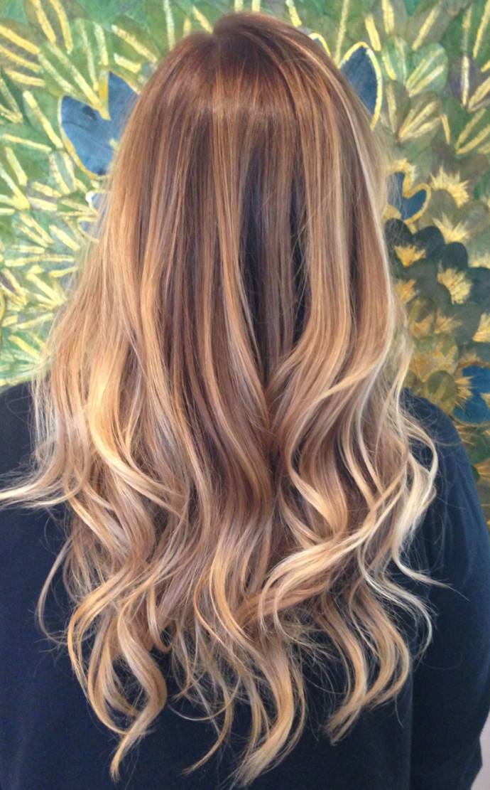 Fashion copper highlights in curly messy hair