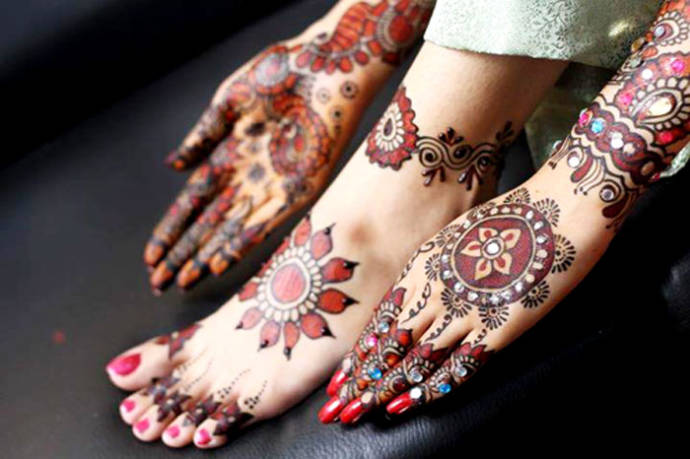 Hands and feet are done in same design with crystals and colors