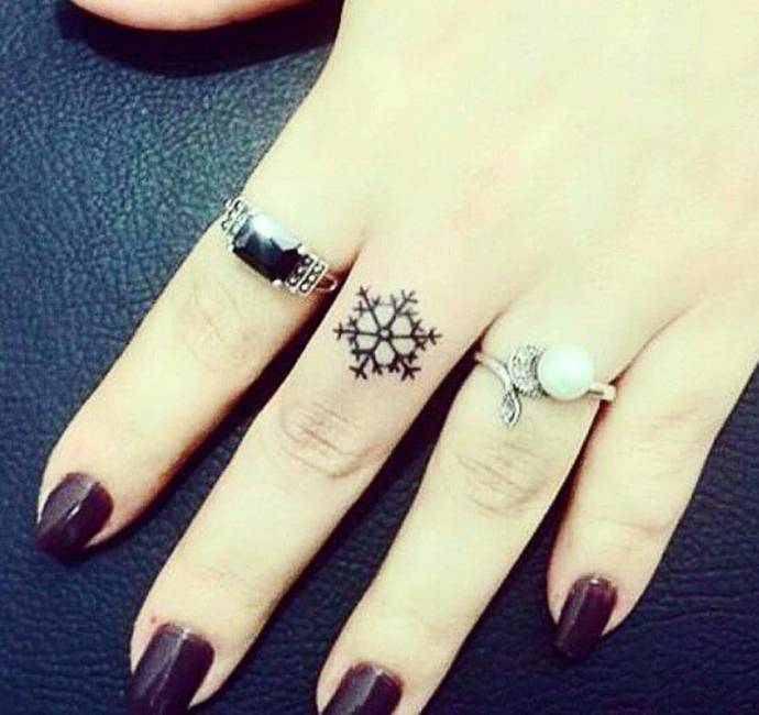 snowflake finger tattoos