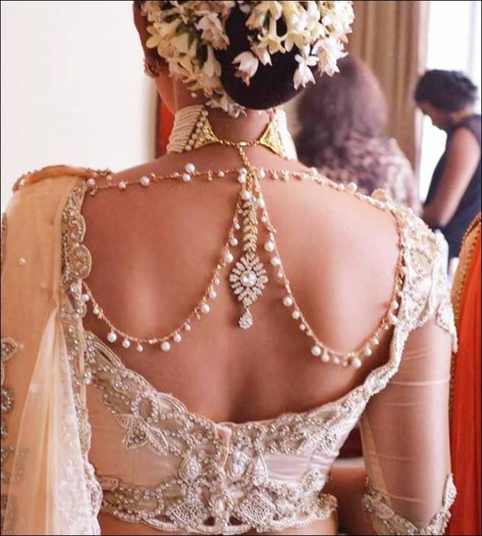 Wedding blouse with jewelry at the back