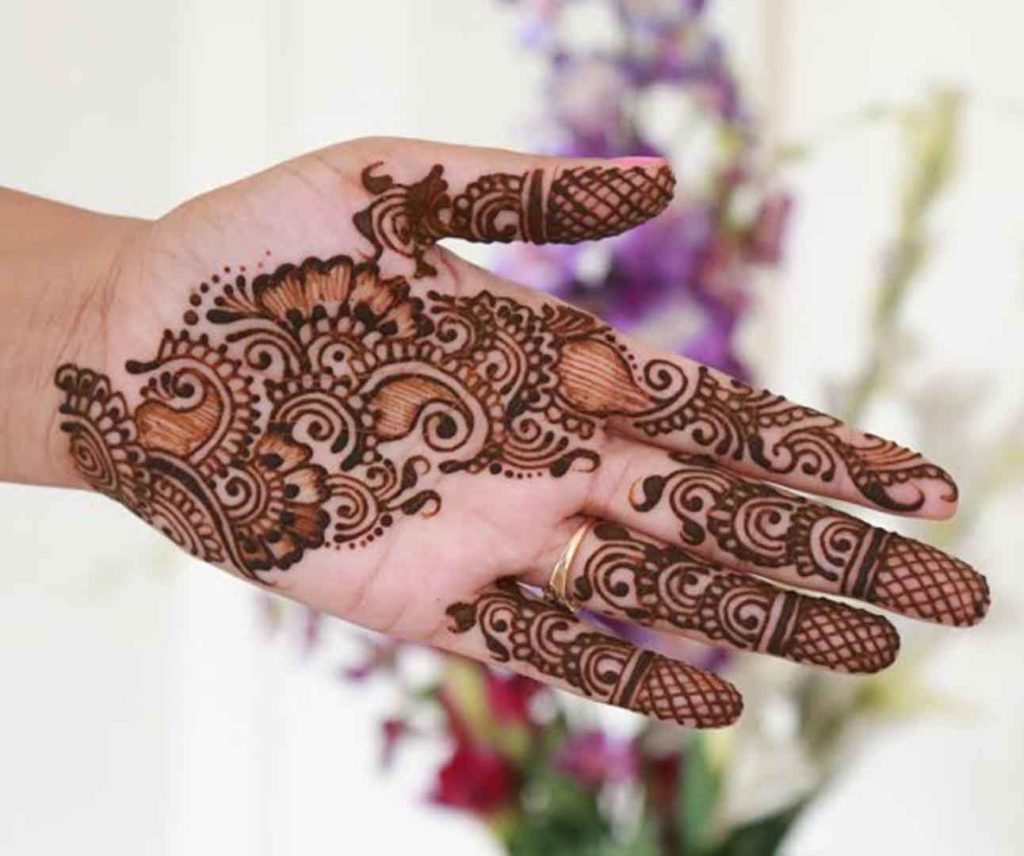 Angular floral and paisley based henna design