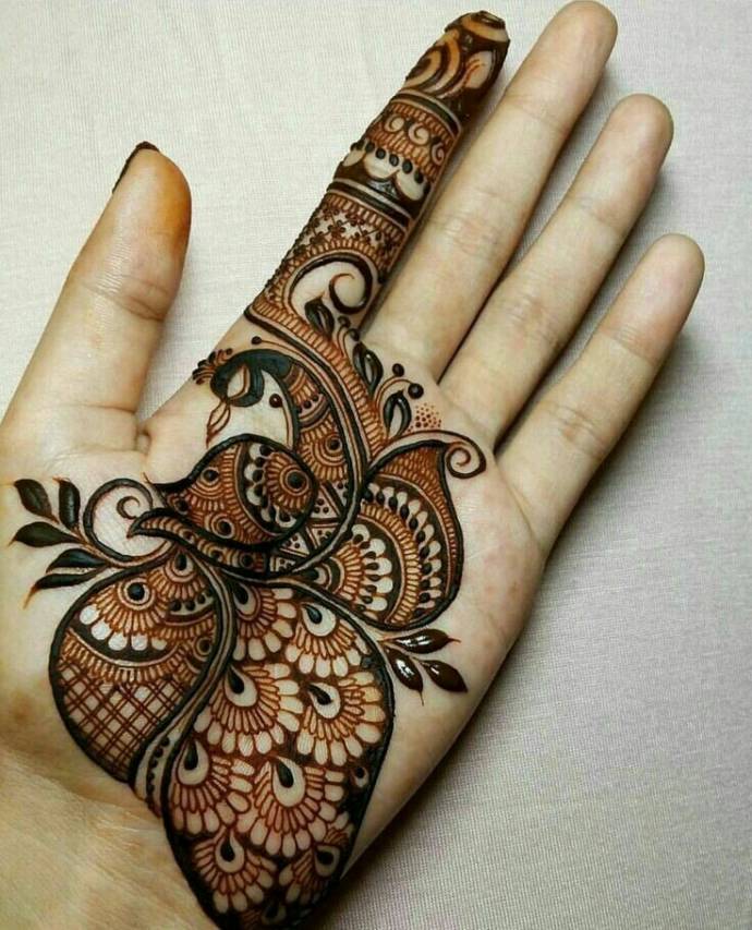 Peacock mehndi design for bride hand