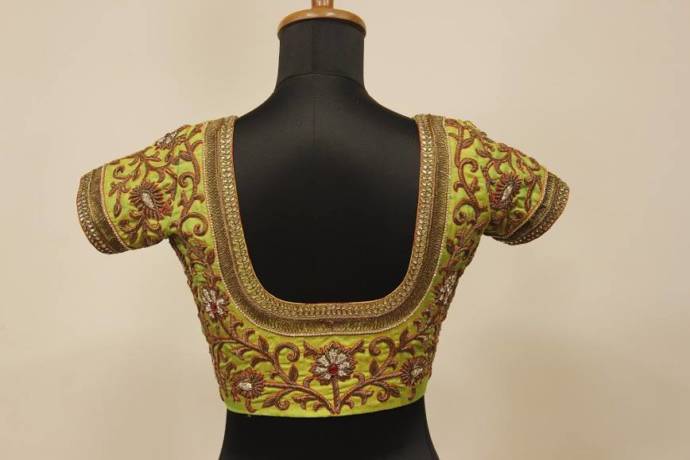 Pastel colored blouse with golden maggam work