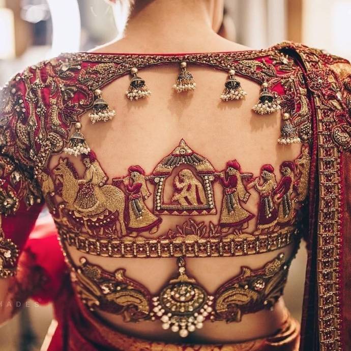 Red embellished blouse with tassels and marriage scene embroidery